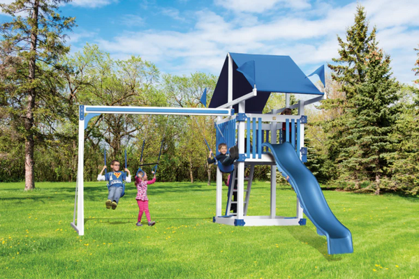 Children playing on a blue and white playground set in a park