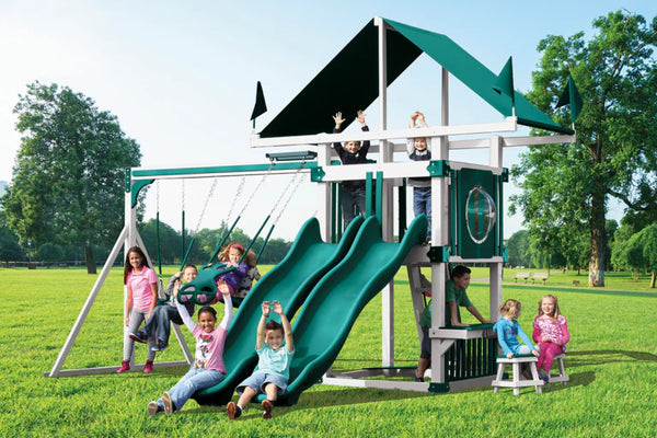 Children playing on a playground set with slides and swings in a park.