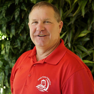 Portrait of customer George Norberg wearing a Detail Home Inspection polo