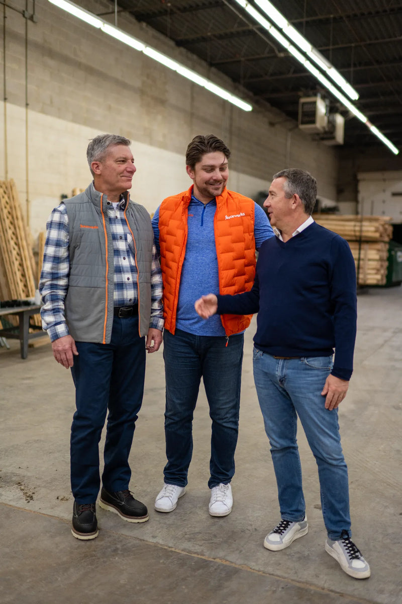 Fenceworks' second and third generation owners, Tom Stotter, Sandy Diamond and Jake Stotter, in the company's lumber warehouse