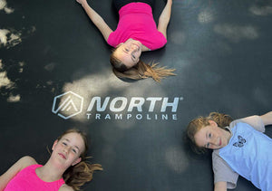 NORTH® 12ft x 8ft Rectangle In Ground Trampoline — in use with children playing