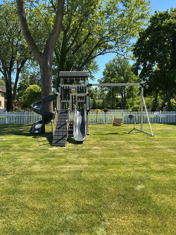 Adventure World vinyl play set installed by Fenceworks in Northfield, IL